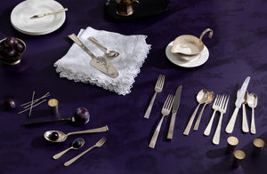 John Corcoran Sterling Silver Creamer with mix of silver flatware on aubergine tabletop