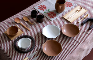 keniichi-dinnerware-atop-tensira-brown-plaid-tableclotoh