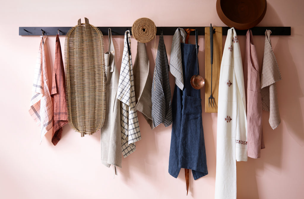 march steel peg rack hung with kitchen linens tools and basket tray