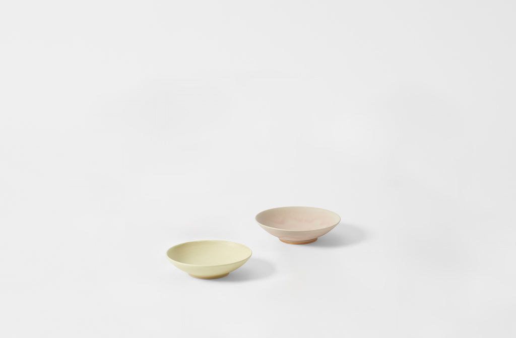 Two Christiane Perrochon ceramic bowls on a white background. Default