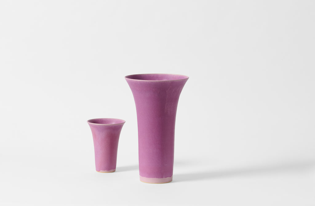 Extra small and extra large Christiane Perrochon flared fuchsia vases.