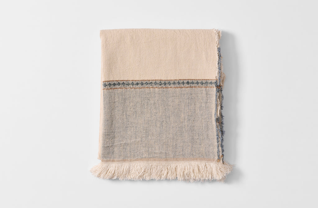 Folded diamond edge linen tablecloth.