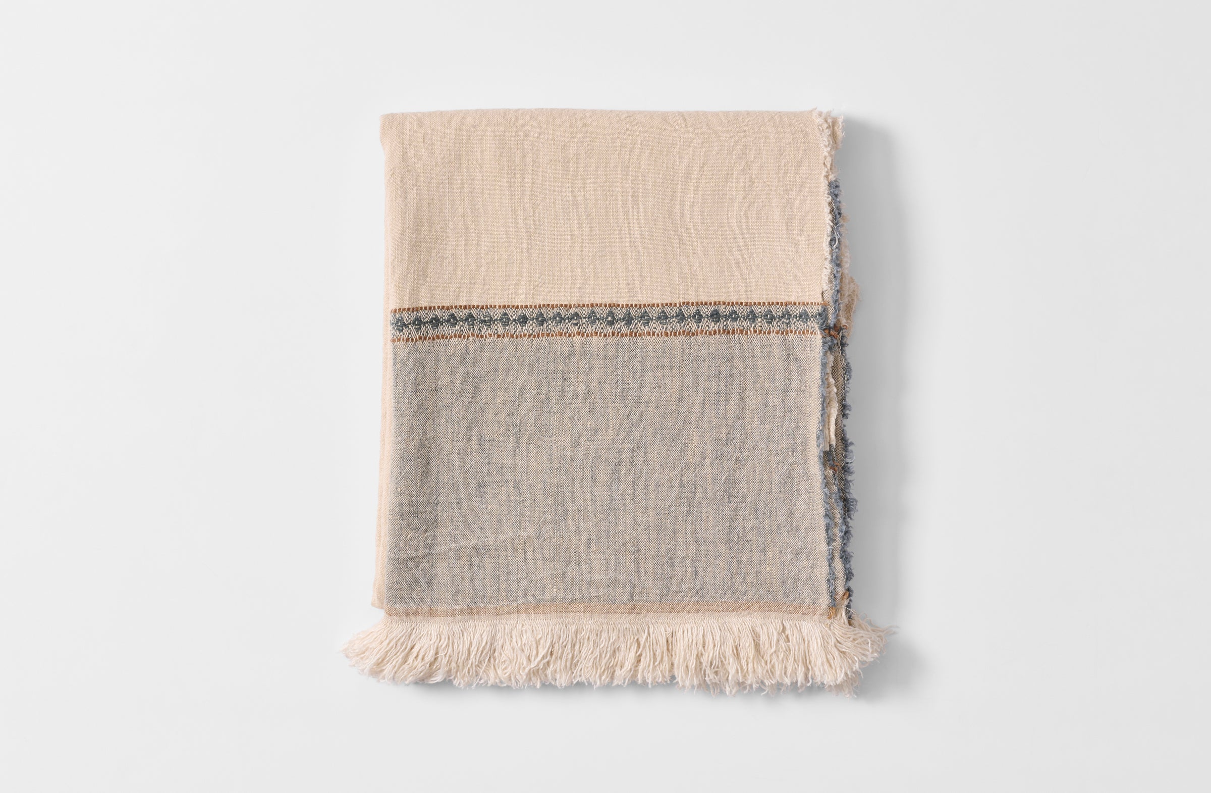 Folded diamond edge linen tablecloth.