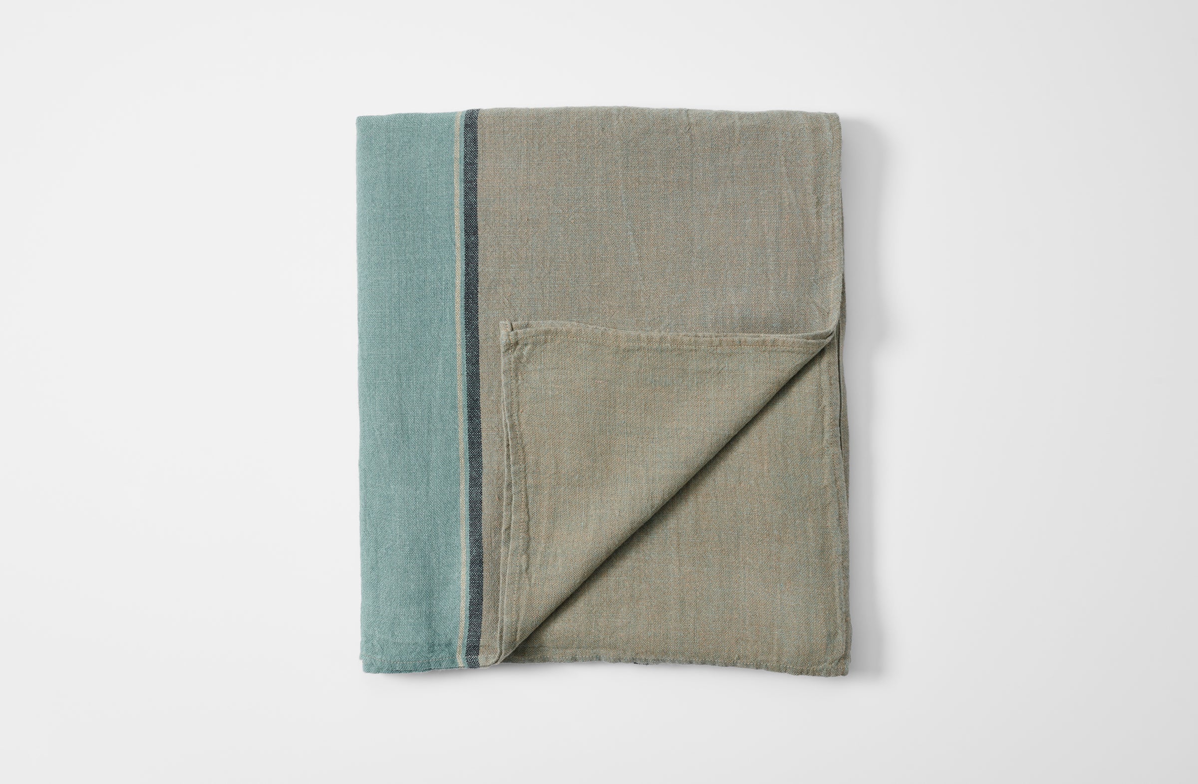 Dublin linen tablecloth folded with detail of reverse.