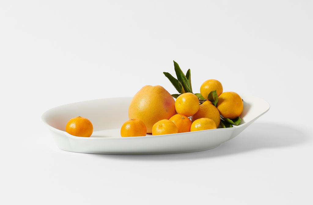 Hering Berlin large white evolution platter holding winter citrus.