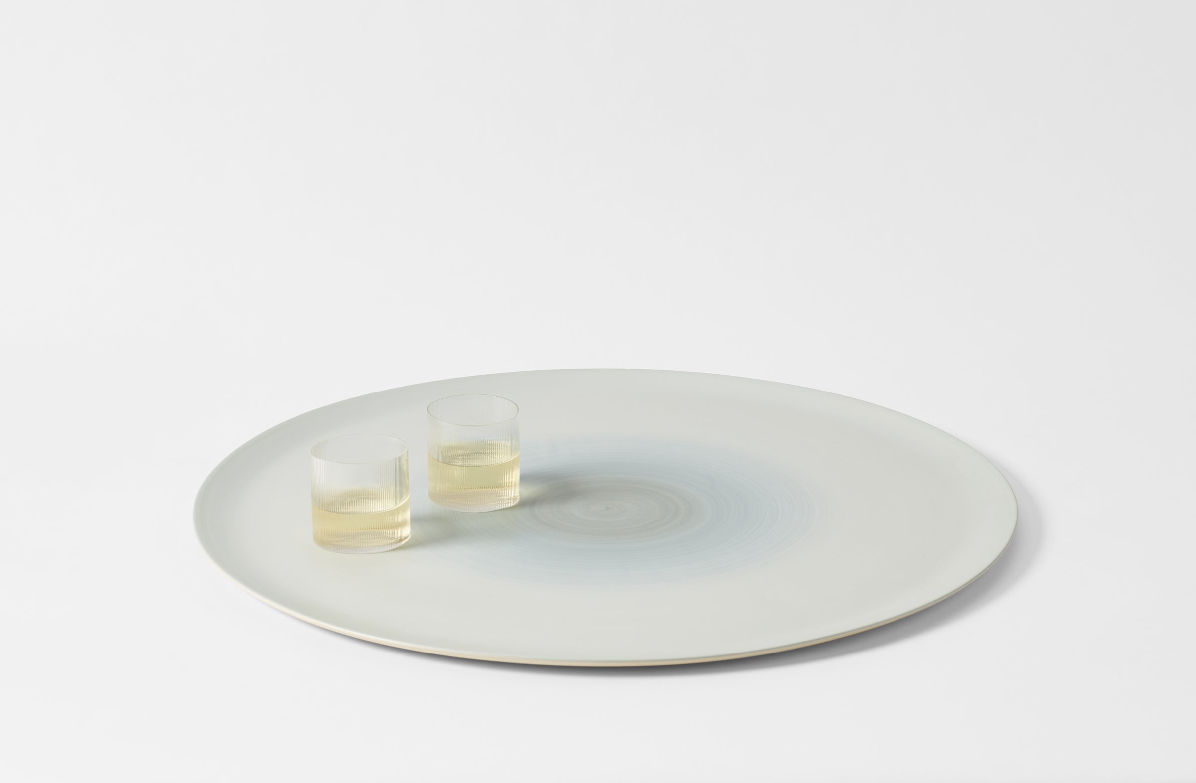 Rina Menardi Extra Large round peel with Melina Kling Circle glasses.