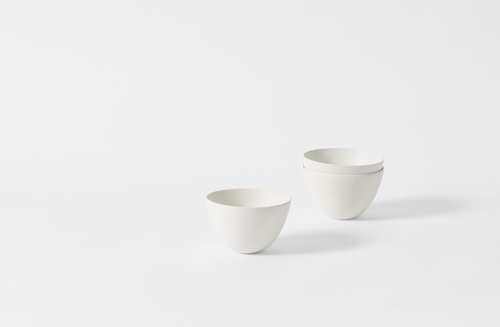 Three small deep white Rina Menardi bowls.