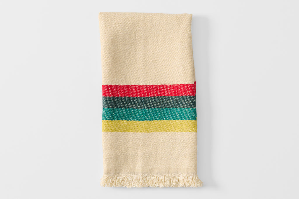 Folded summer stripe kitchen towel.