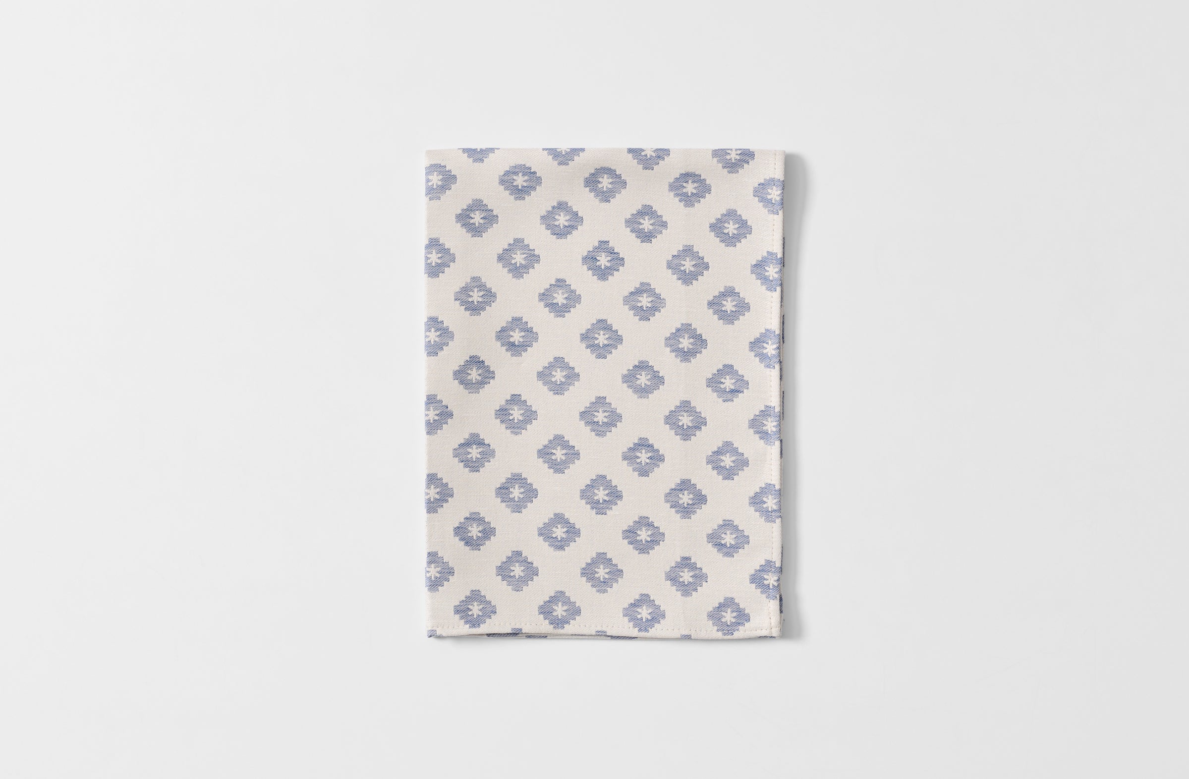 Folded Tori Murphy indigo diamond kitchen towel.