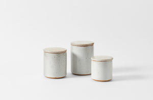 Trio of Victoria Morris white speckled canisters. Default.