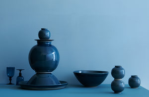 Christiane-Perrochon-Teal-Ceramics-Stacked-with-Davide-Fuin-Blue-goblets-against-teal-background-Default