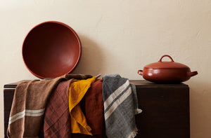 Libeco-kitchen-towels-draped-over-table-with-redware-pottery-MARCH -Default