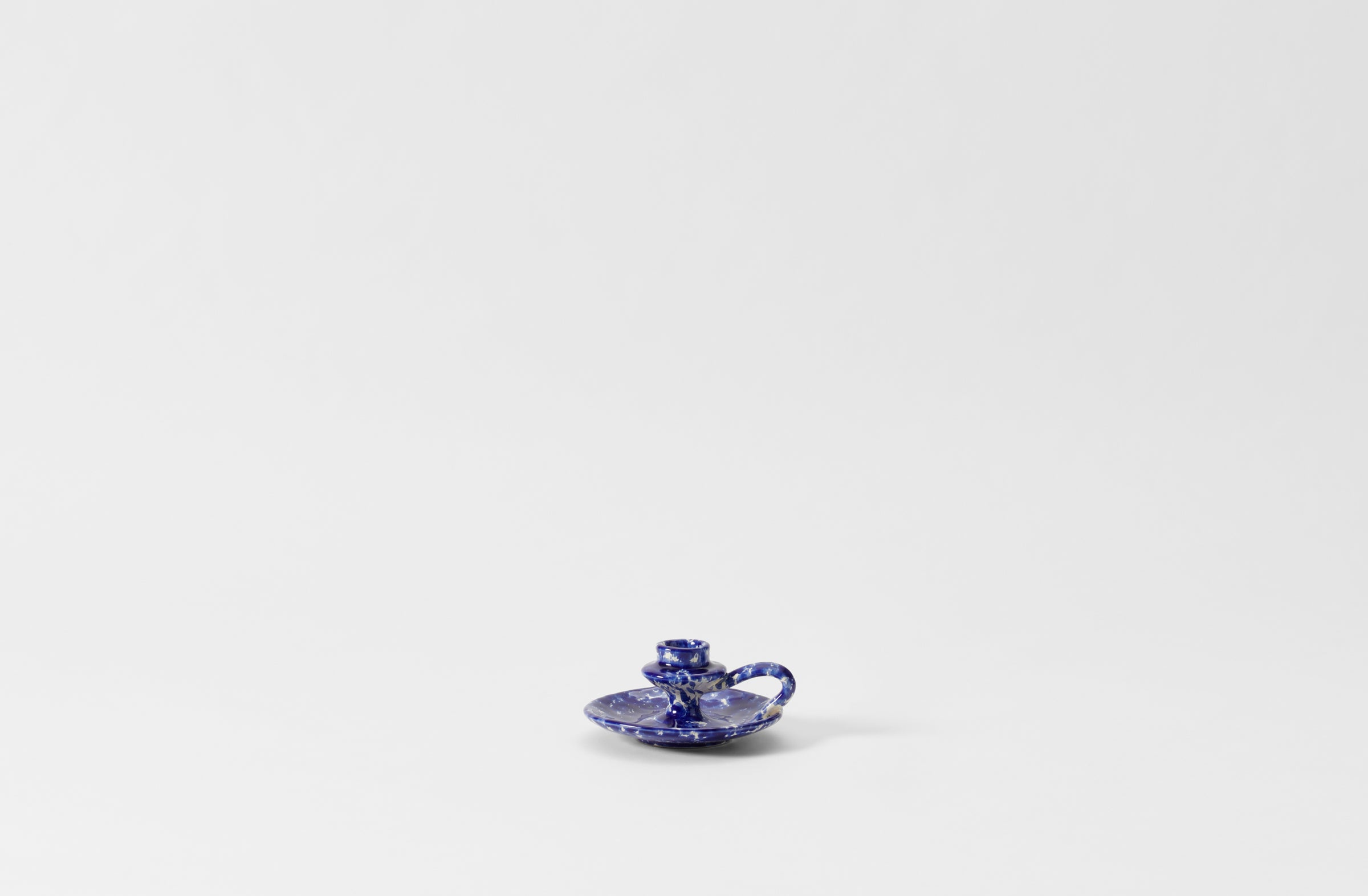 blue on cream splatterware chamberstick candleholder