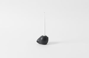 carol leskanic black gesso short sculptural candlestick with a white taper candle