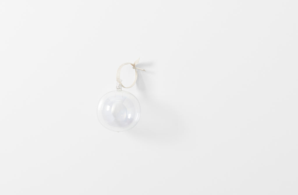 iridescent large clear mouth blown glass ornament shown singly with linen ribbon loop