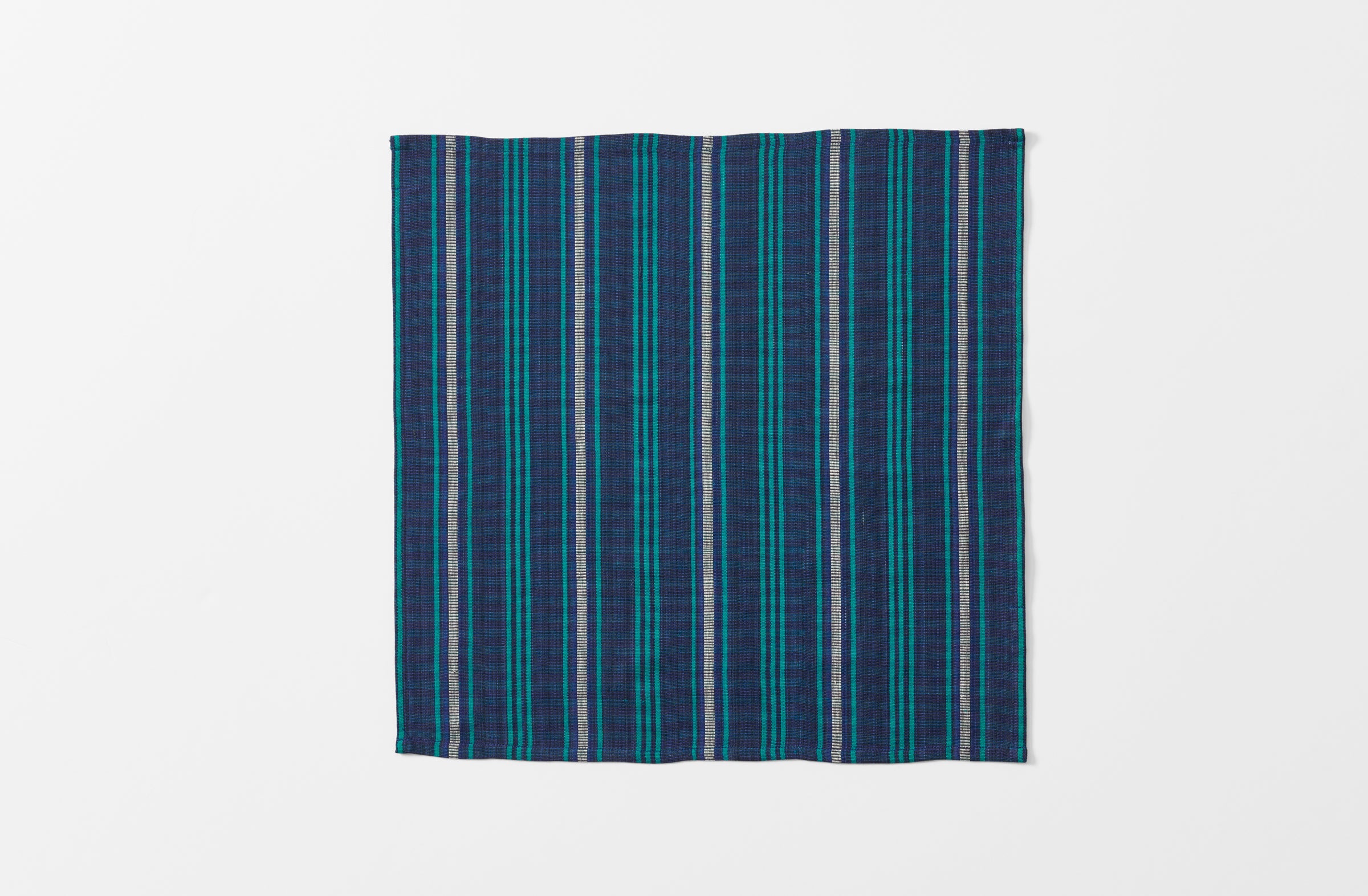 single tensira navy and green tartan napkin shown unfolded
