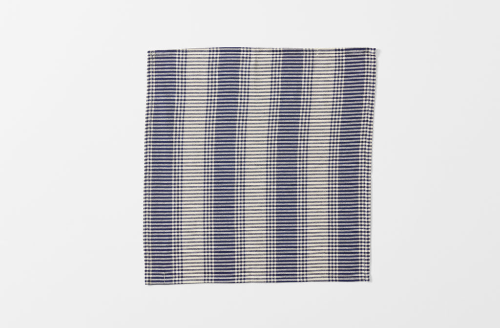 single tensira navy and natural tartan napkin shown unfolded