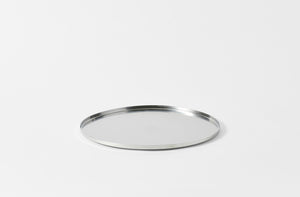 stile pewter steel round tray in a matte finish