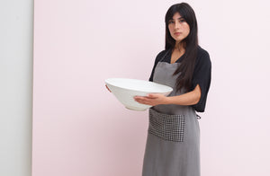 Model wearing Once Milano for MARCH grey linen with gingham pocket apron