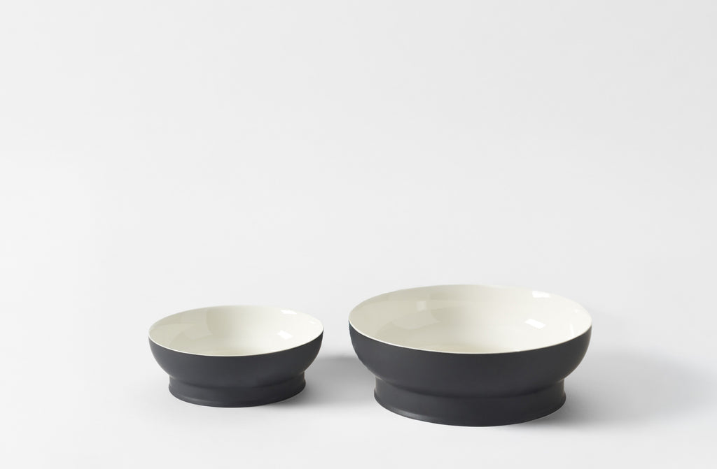 Two black and white ceramic Ann Demeulemeester bowls on a white background. Default 