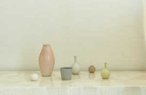 Christiane Perrochon pale pastel vases set atop Faye Toogood Sculpture table in a tableau reminiscent of Georgio Morandi.