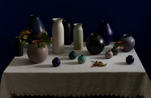 Default:: Mixture of Christiane Perrochon vases set on off white Sicily table cloth 