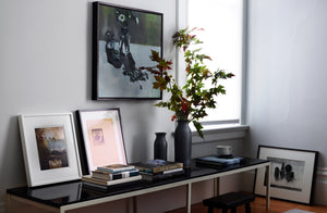 Bench under Susan Ashworth Anemones and Cafetiere painting with art books Christiane Perrochon grey blue bottle vases with branches of maple leaves and white mug. Default