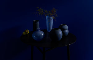 Decorative blue vases by Davide Fuin and Victoria Morris on Sawkille Co. Ebonized Black Walnut Spindle Table