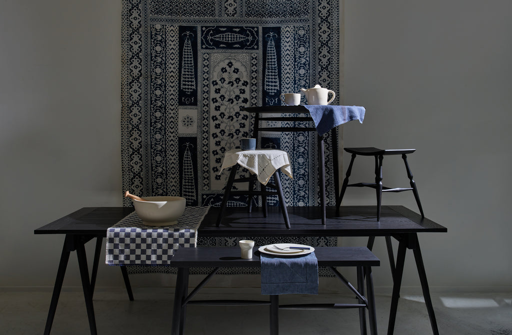 Ebonized furniture with mix of linens 