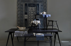Ebonized furniture with mix of linens 