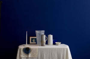 A mix of new and vintage tabletop items in white, cream, and cobalt.