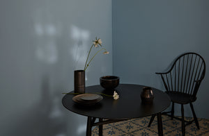 Winter light reflected on wall behind Tracie Hervy graphite vases and Michaël Verheyden Patinated Brass Bowl with wazara silver plates on Sawkille Ebonized Black Walnut Spindle Table 