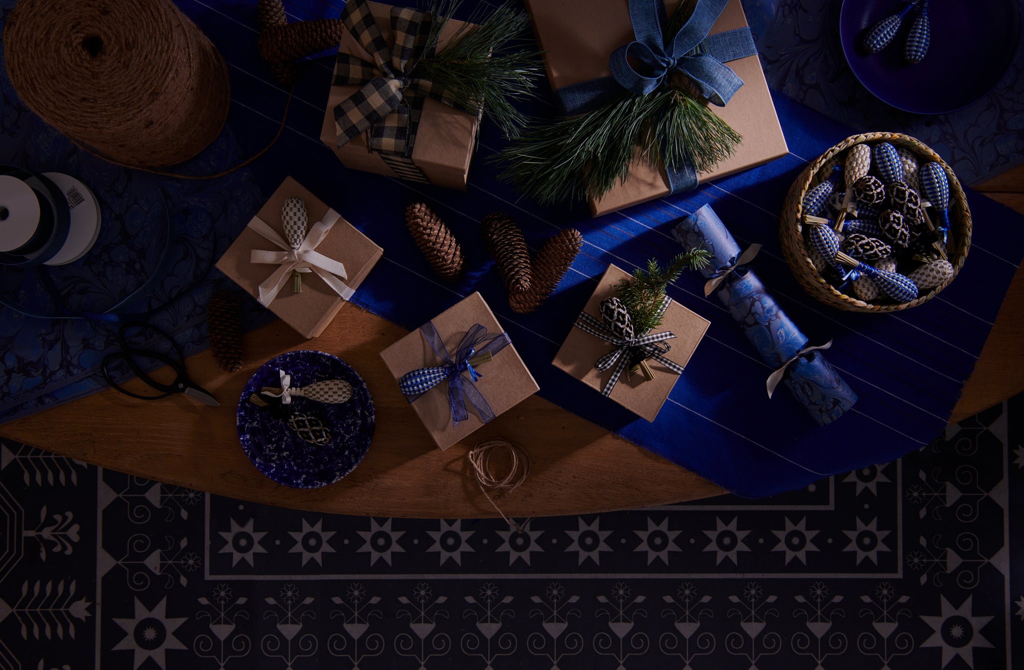 Lavender wand topped gift boxes with MARCH celebration crackers on Chroma cobalt stripe runner