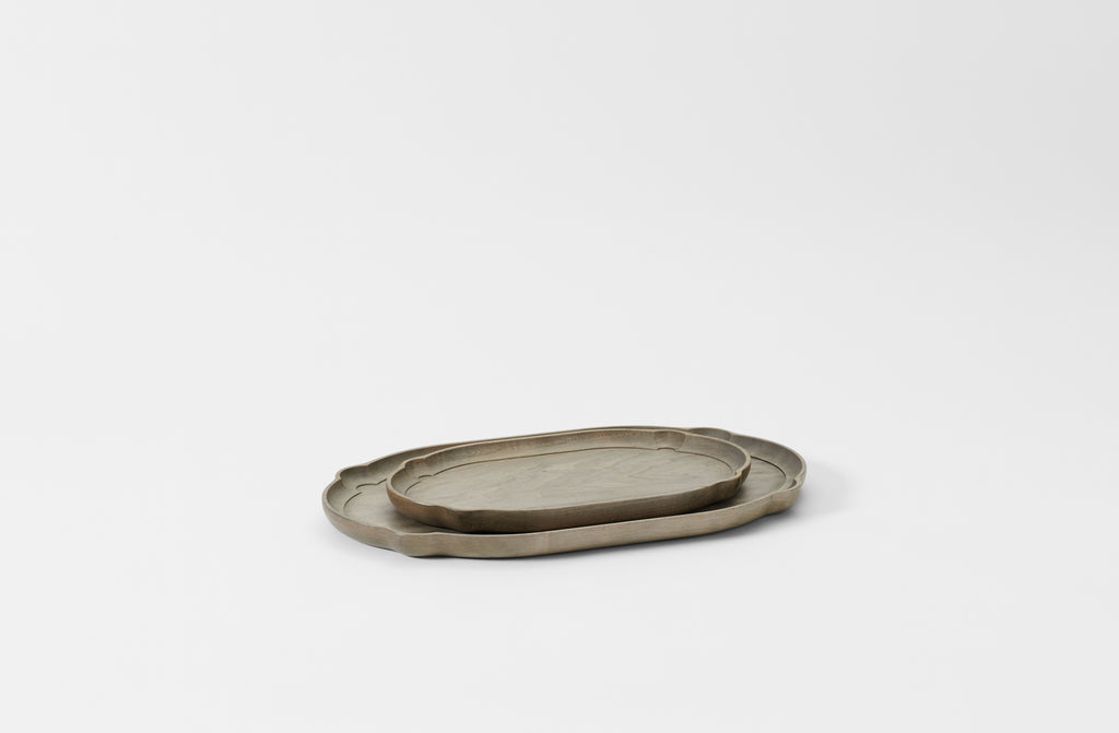 Two oval nested trays on a light gray background. Default