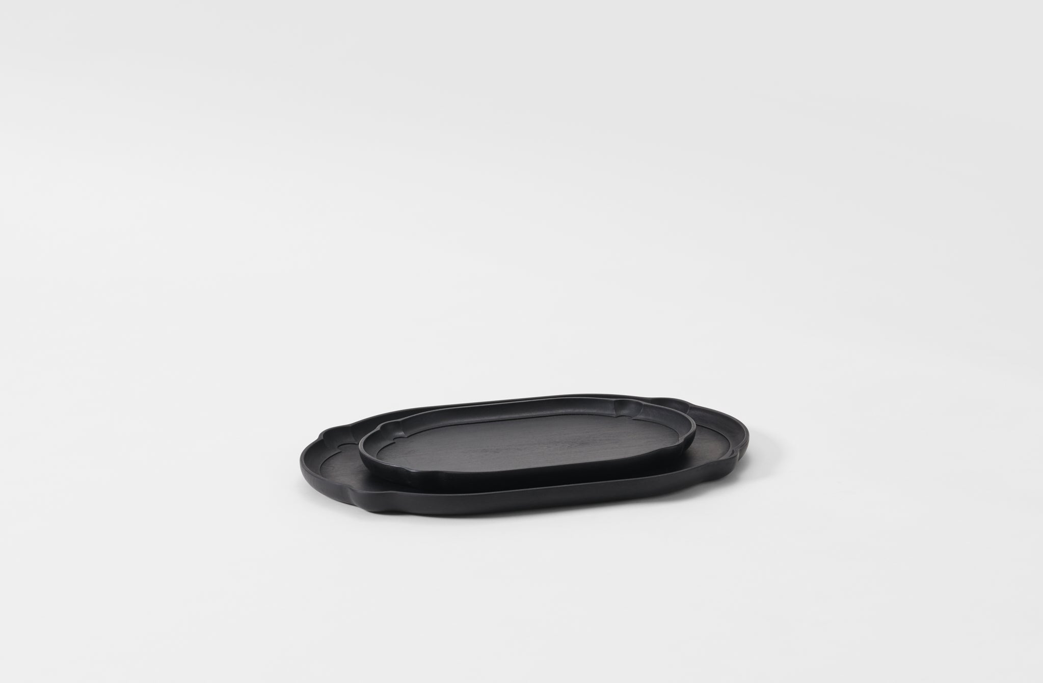 Black rectangular plate on a light gray background. Default