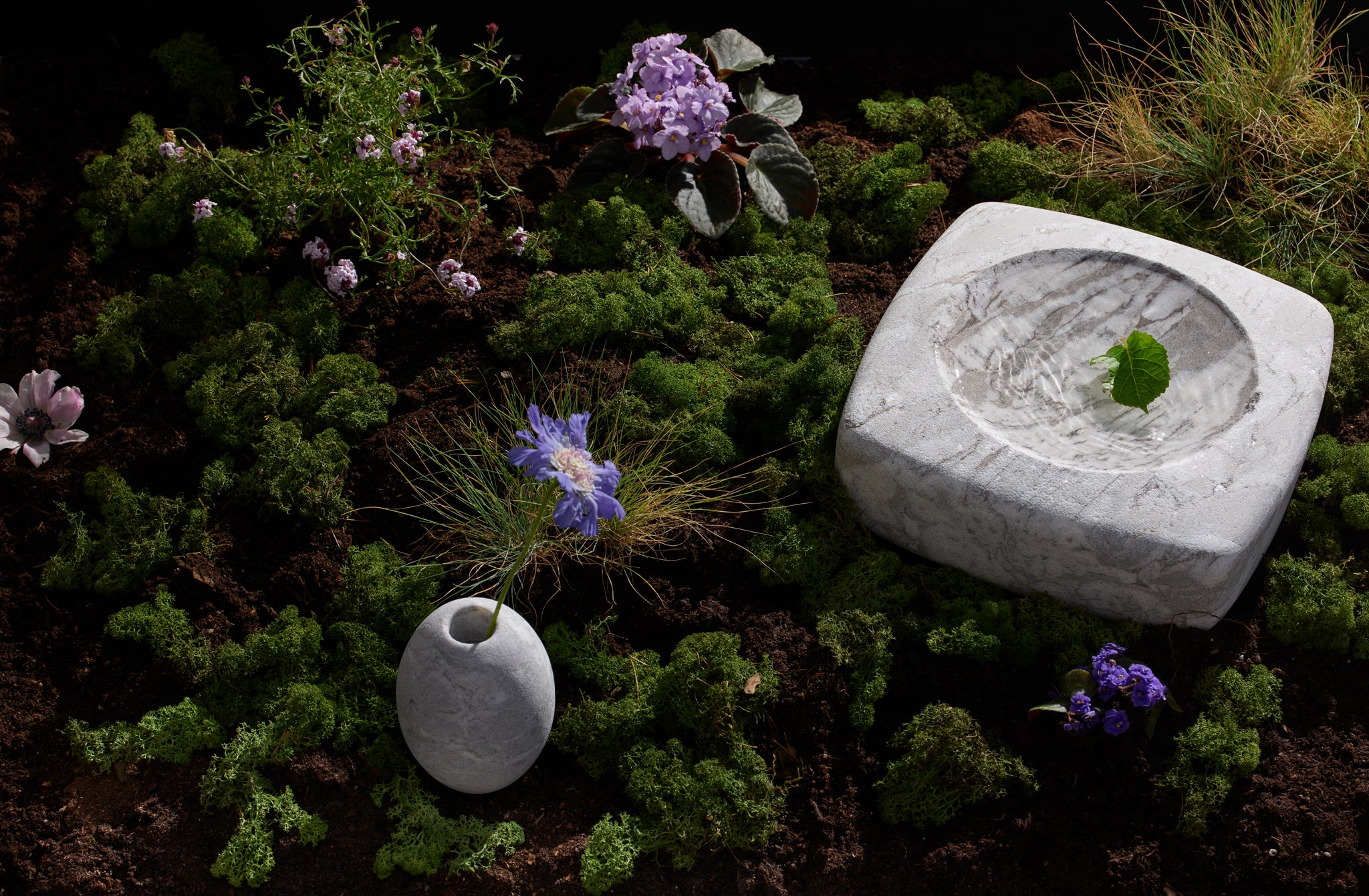 Michael Verheyden mondragone vessels in mossy still life landscape with purple flowers