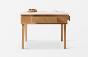 Bespoke Bakers Table with drawers open with loaf of bread and rolling pin. 