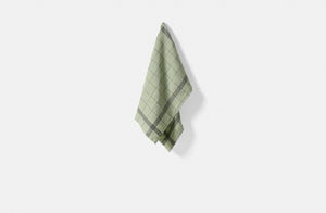 Bistrot kitchen towel in sage hanging.