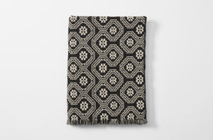 Black and grey cerpa blanket folded
