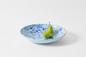 Seventeen inch blue on blue splatterware serving platter holding bright green pears
