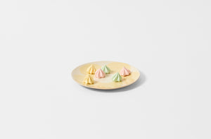 Brickett Davda butter yellow flower dessert plate with colorful meringues.