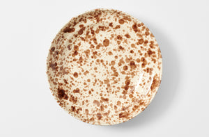 Seventeen inch brown on cream splatterware serving platter overhead.
