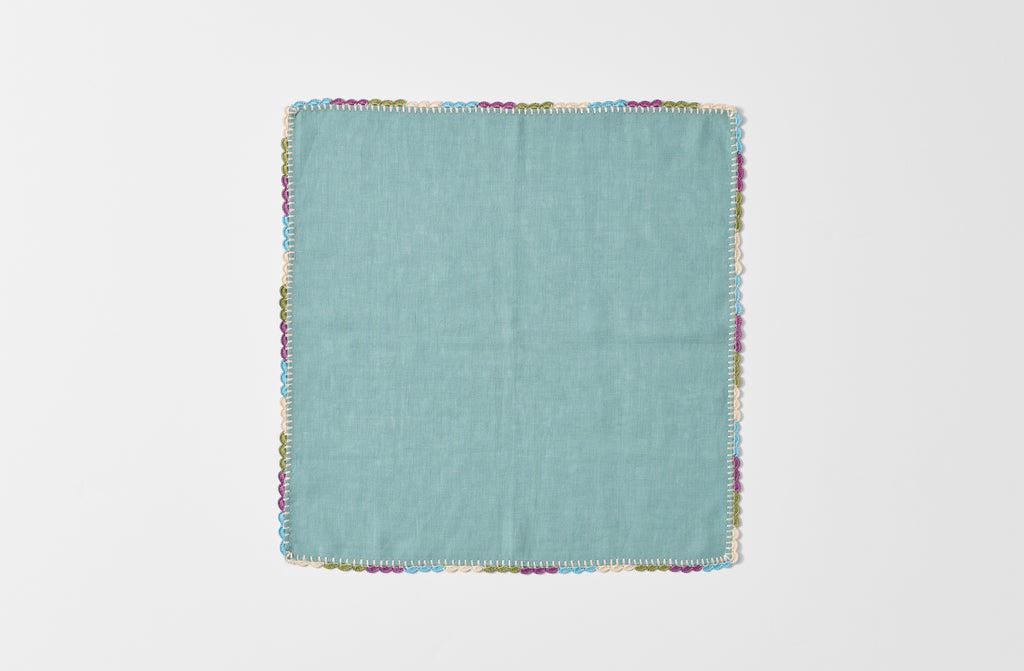 Detail of opened cairo linen napkin with crocheted hem.
