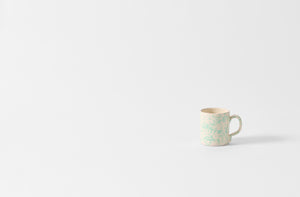 celadon and cream splatterware mug.