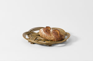 Large celtic knot basket holding loaf of bread.