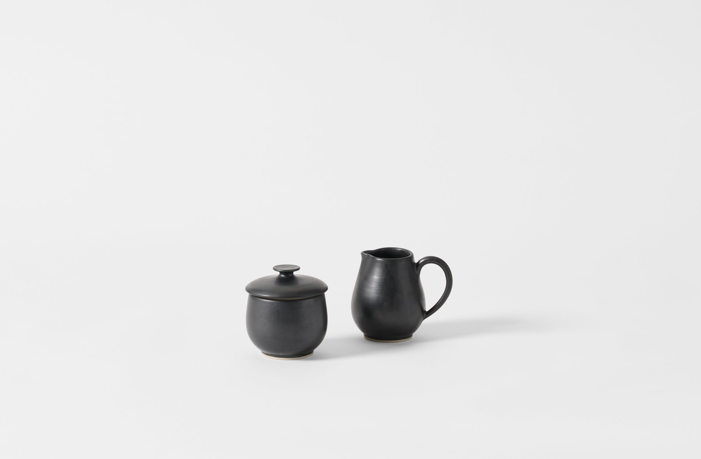 Black Christiane Perrochon sugar bowl and creamer.