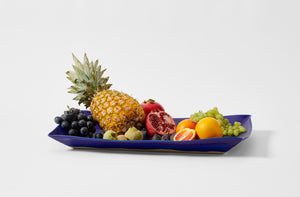Christiane Perrochon large blue violet tray holding winter fruits