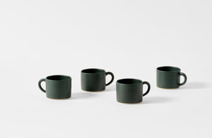 Four Christiane Perrochon bottle green mugs