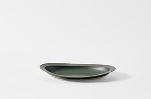 Christiane Perrochon bottle green rimmed oval dish.