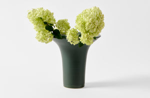 Christiane Perrochon extra large flared bottle green vase with hydrangeas.